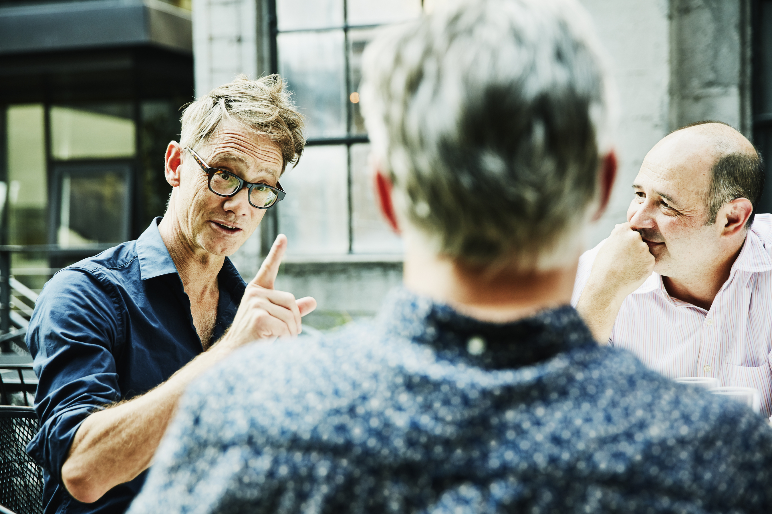 Three persons talking